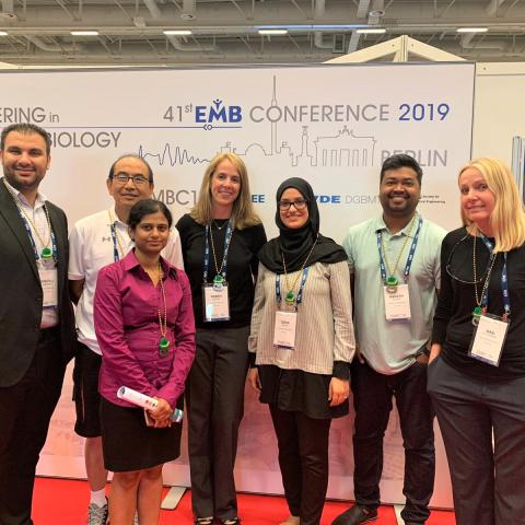Seven Kessler Foundation staff at a conference in Germany
