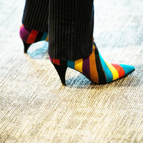 A striped colorful pair of shoes 