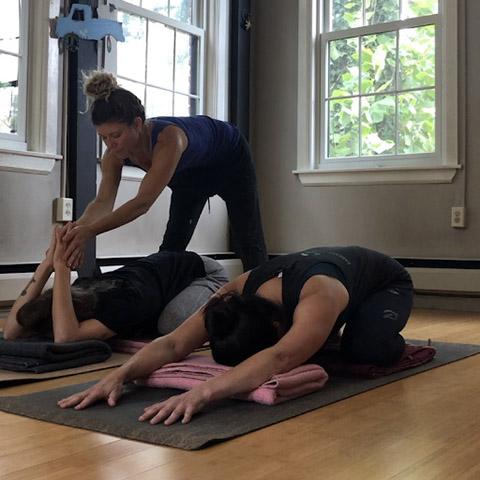 Gina Pachkowski instructs students in a "Love Your Brain Yoga" class at her studio in Cranford, NJ.