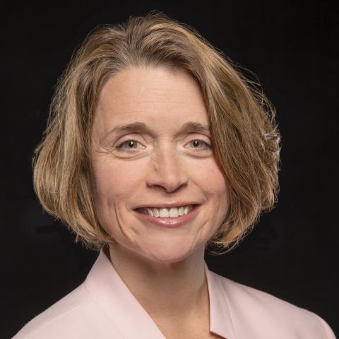 Head-shot of Dr. Nancy Chiaravalloti against a black background