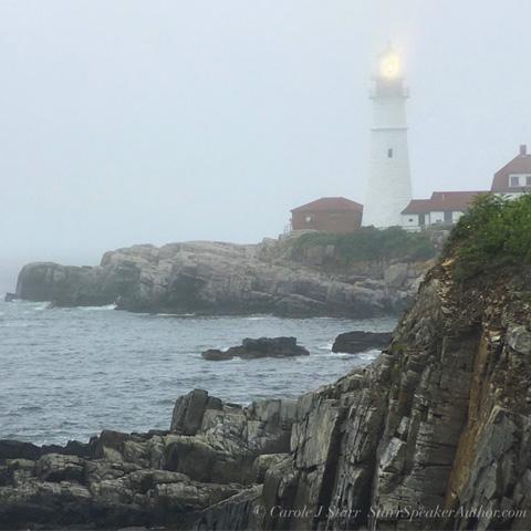 Mentors: A Light Through the Fog Lighthouse beach with rocks