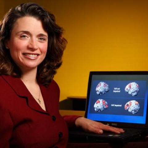 Dr Nancy Chiavorlotti sitting in front of her computer