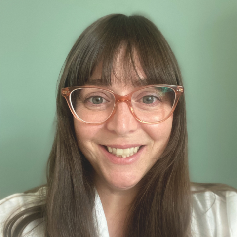 Image of Dr. Jennifer Russo. She has long brown hair and glasses.