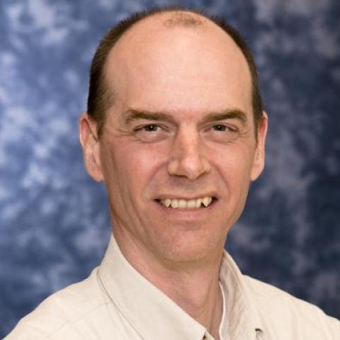 dr wylie wearing a beige shirt