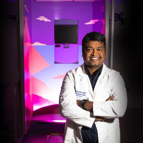 Photo of Dr. Rakesh Pilkar standing with his arms folded and smiling 