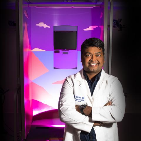 Brown skin, Asian male, standing next to equipment