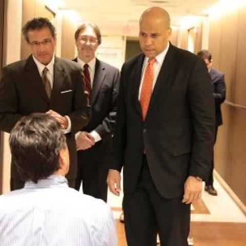senator cory booker and ceo rodger derose of kessler foundation together on tour of the foundation facility. 