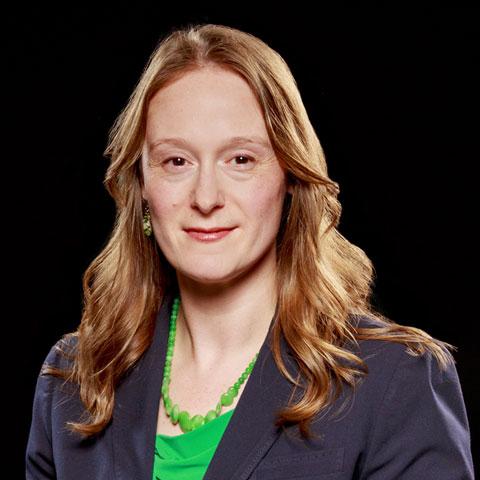 female assistant director profile picture on a black background