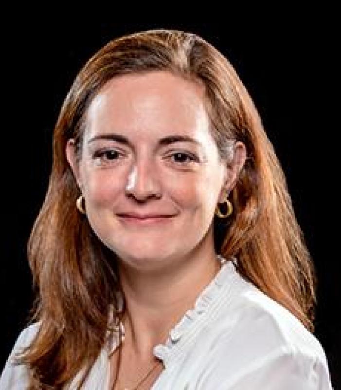 female research scientist director with brown hair at Kessler Foundation wearing a white blouse