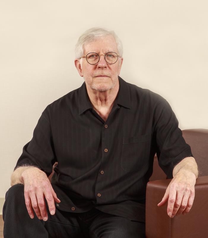 John O'Neill, man in black shirt and glasses, gray hair