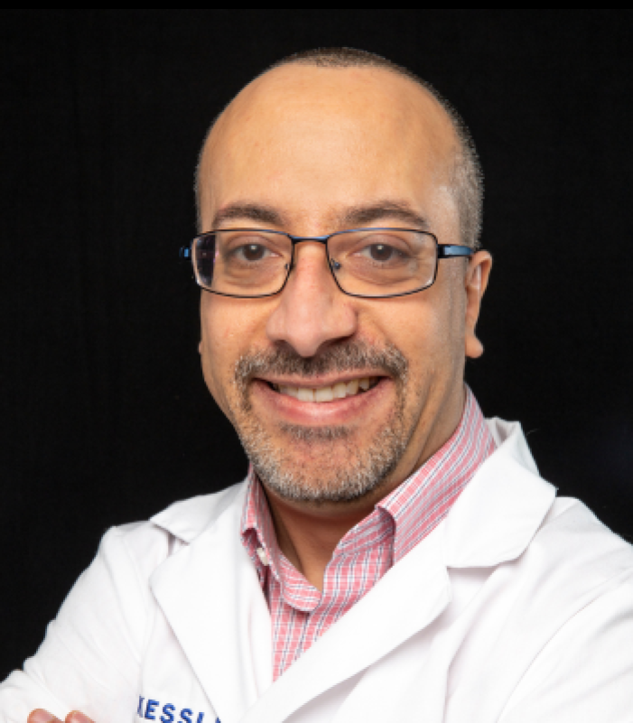 Headshot of Anthony Lequerica, PhD. He is wearing glasses and a white lab coat.
