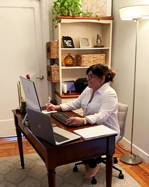 Dr. Lauren Strober sitting at her desk at home