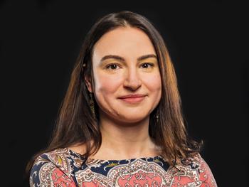 Headshot of Olga Boukrina, PhD on a black background