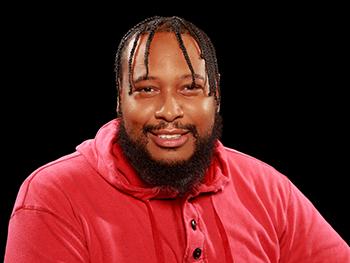 Headshot of Jamil Williams with black background