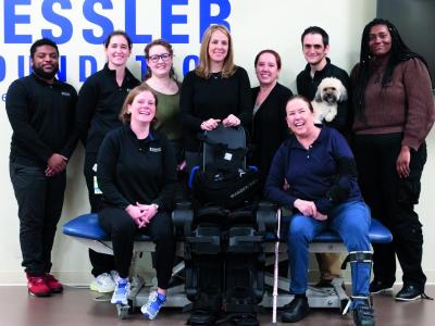 Suzanne cliff (first row, right) with her "chosen" family, Dr. Karen J. Nolan (back row, center) and the robotic exoskeleton research team.