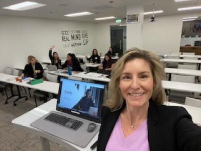 Angela Pennella in a lecture classroom with students