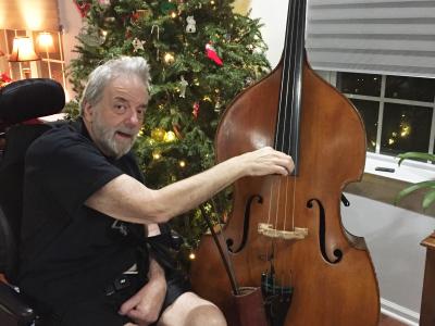 A person playing a double bass